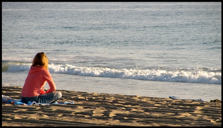 Woman watching the tide come in