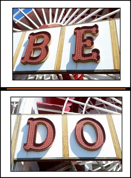 The words "be" and "do" on neon signs