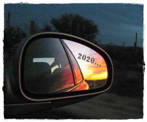 Sunset in a car's rearview mirror, with 2020 in text overlay